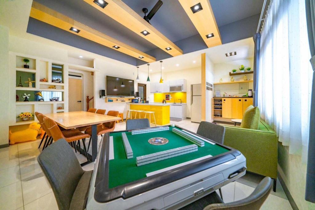 a living room with a pool table in it at 新森活民宿 in Wujie
