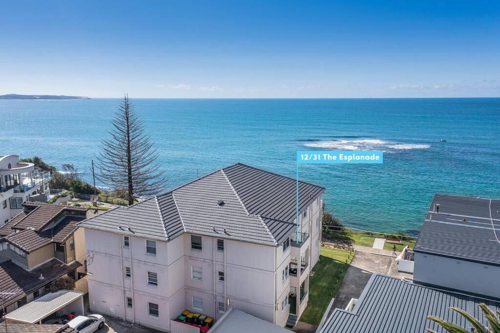 an aerial view of a house and the ocean at On The Esplanade - Close to beach & Cronulla mall with Aircon in Cronulla