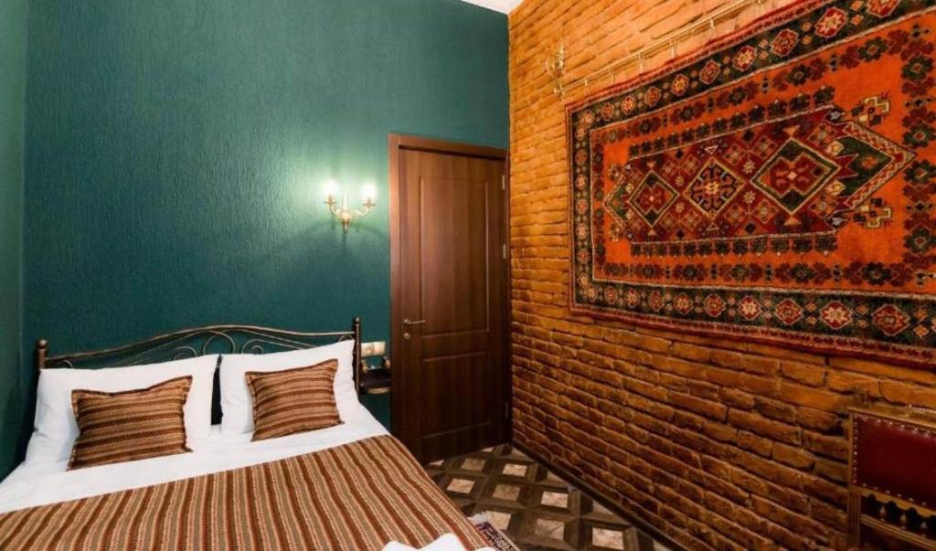 Postel nebo postele na pokoji v ubytování Vorontsoff Inn Boutique Hotel