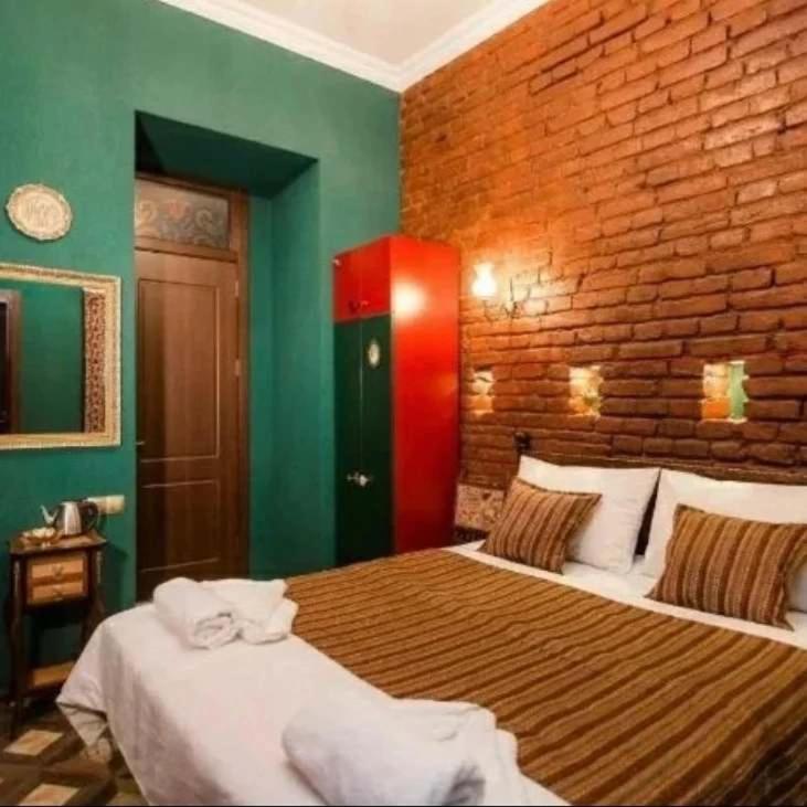 Postel nebo postele na pokoji v ubytování Vorontsoff Inn Boutique Hotel