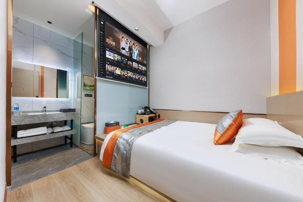 Postel nebo postele na pokoji v ubytování Guangzhou Yachen Hotel