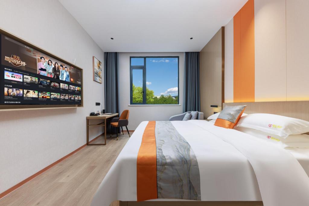 Postel nebo postele na pokoji v ubytování Guangzhou Yachen Hotel