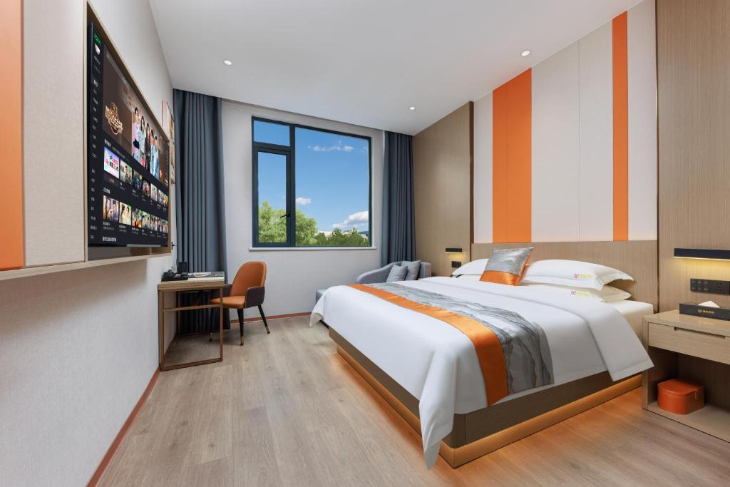Postel nebo postele na pokoji v ubytování Guangzhou Yachen Hotel