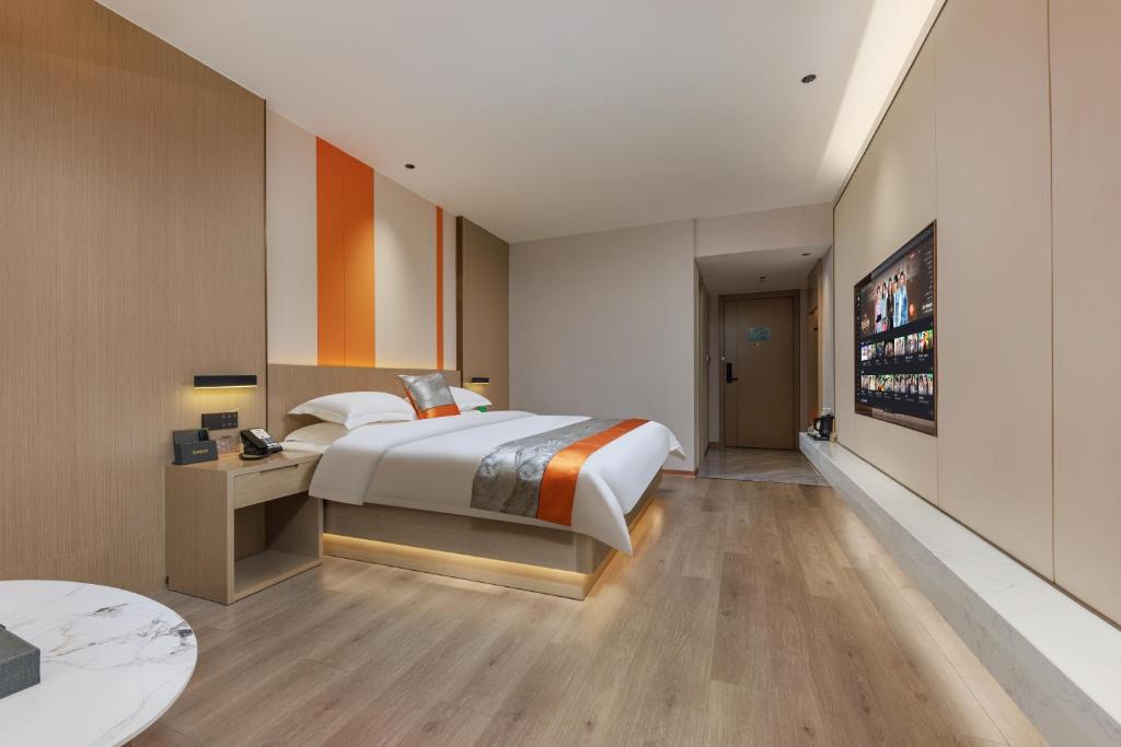 Postel nebo postele na pokoji v ubytování Guangzhou Yachen Hotel