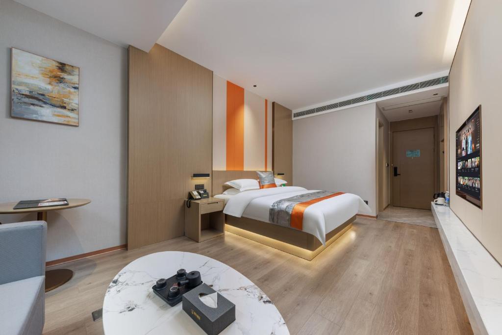 Postel nebo postele na pokoji v ubytování Guangzhou Yachen Hotel