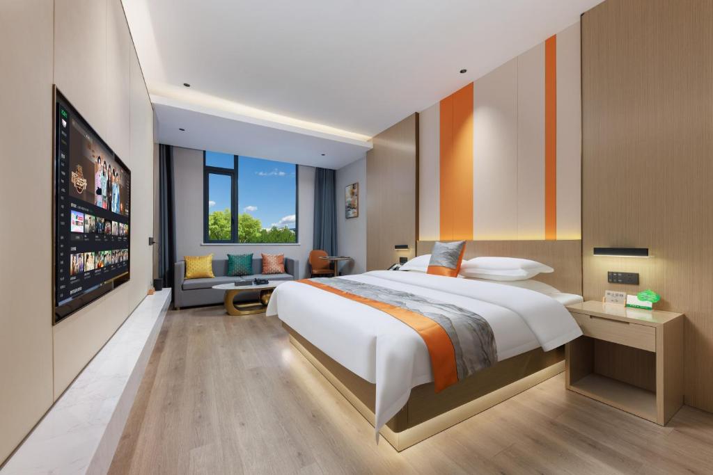 Postel nebo postele na pokoji v ubytování Guangzhou Yachen Hotel