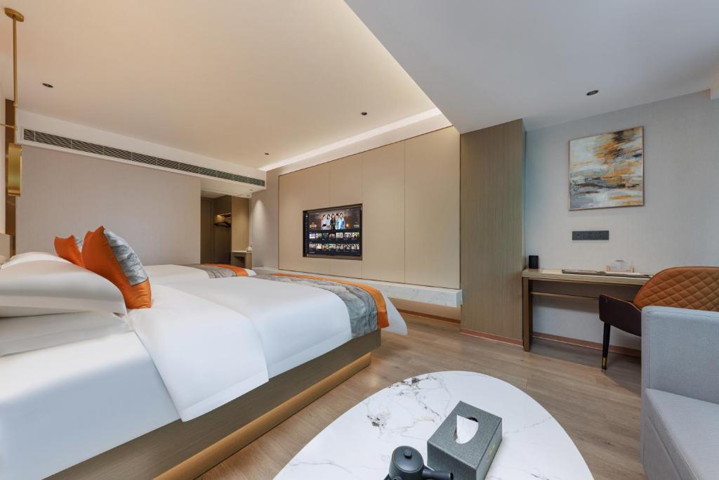 Postel nebo postele na pokoji v ubytování Guangzhou Yachen Hotel