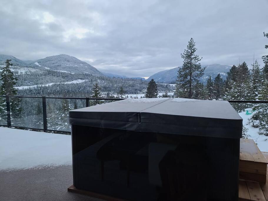 a black box sitting on a balcony with a snow covered mountain at Five Star-Amazing views and Hot Tub in Crescent Valley