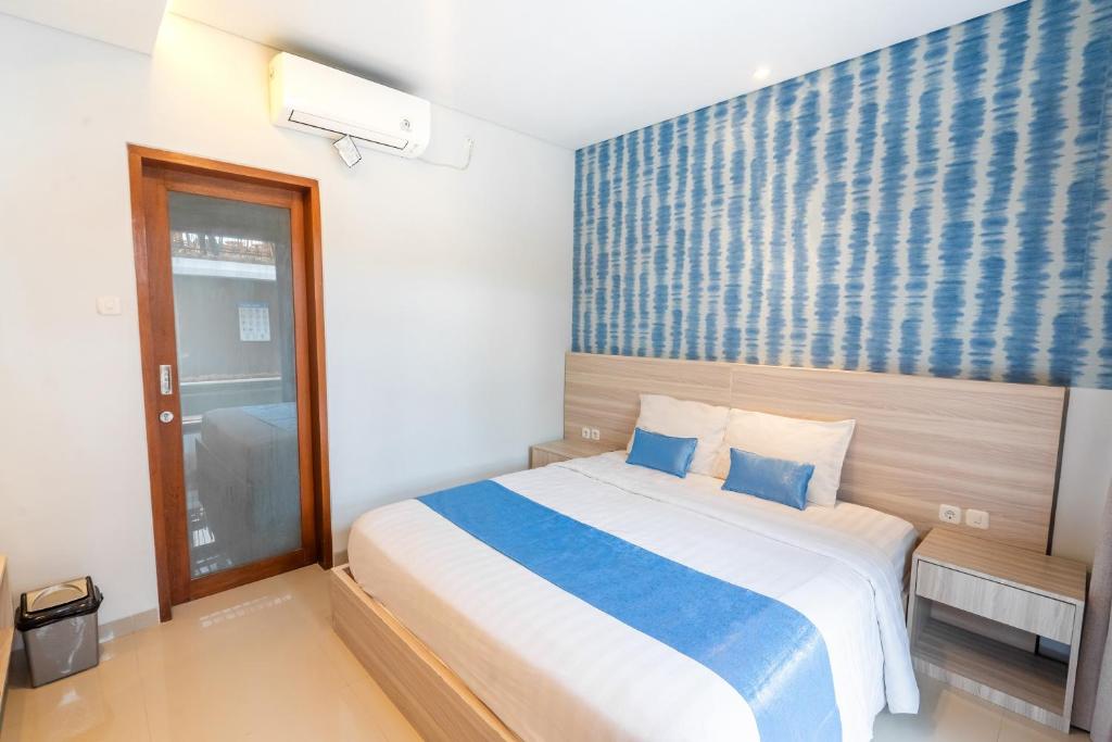 Postel nebo postele na pokoji v ubytování Mahesa Suites Seminyak