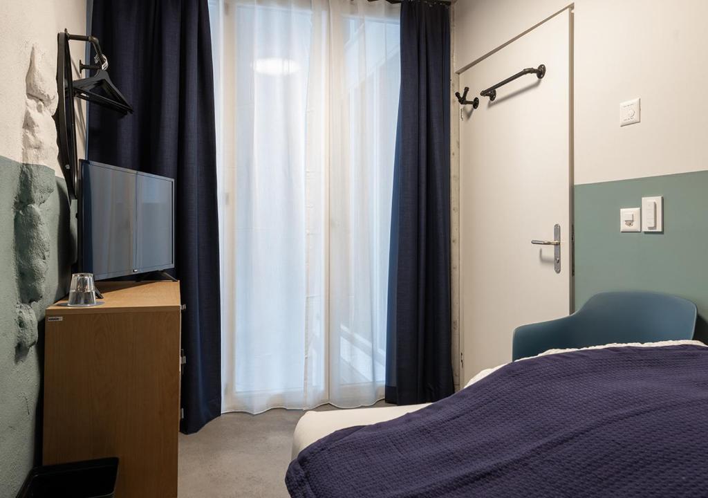 Postel nebo postele na pokoji v ubytování Ambrosia Hüsli