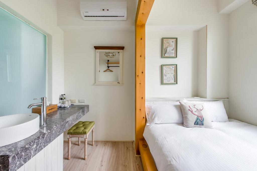 Postel nebo postele na pokoji v ubytování Wilderness1138 Hualien B&B