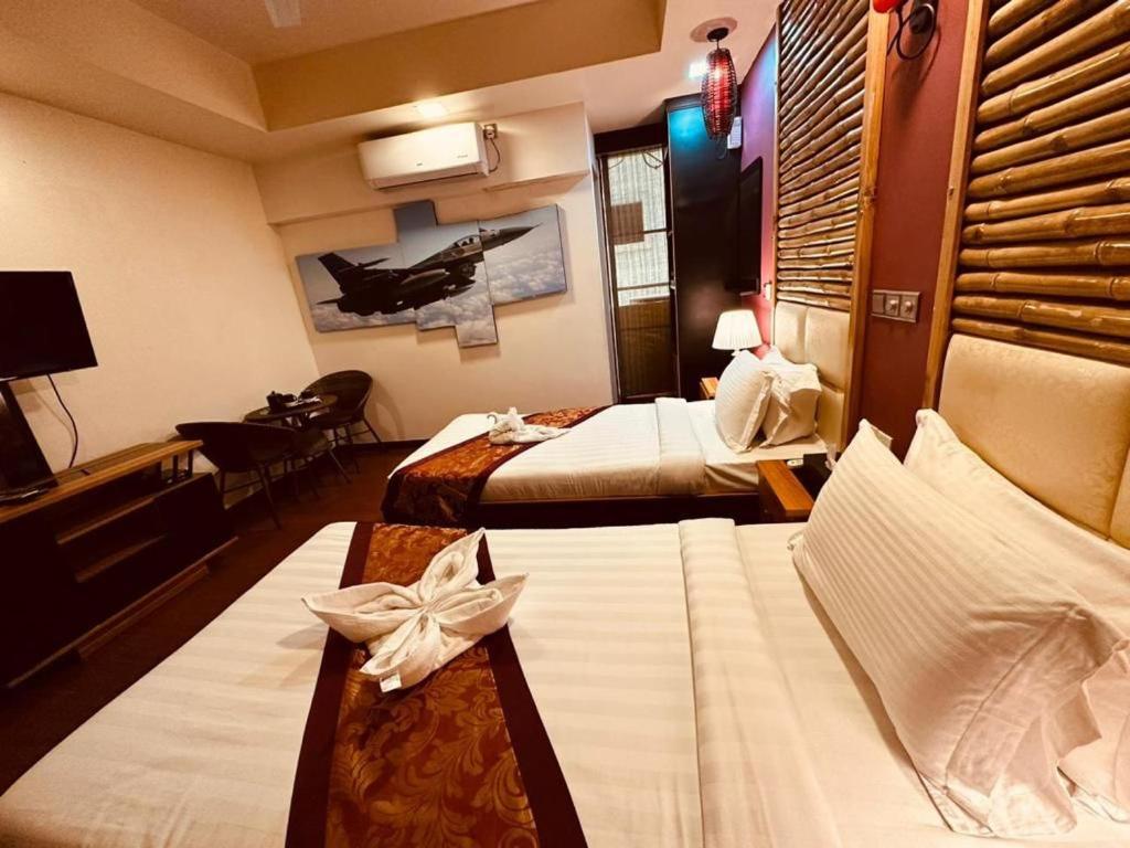 A bed or beds in a room at ila grand