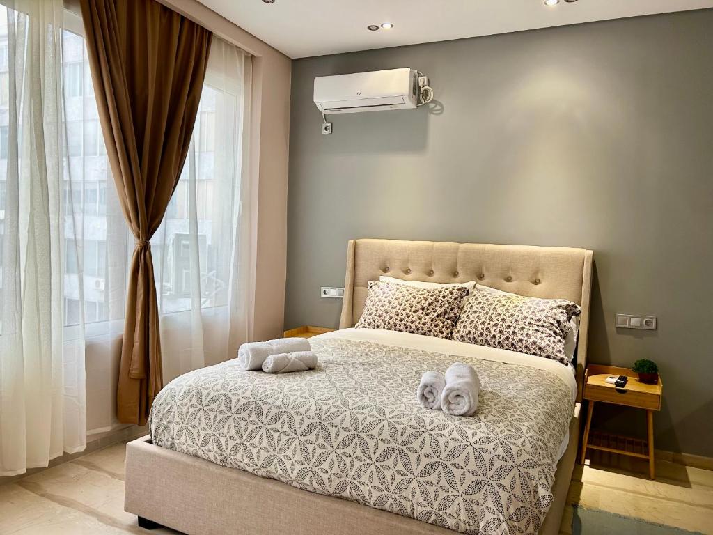 Postel nebo postele na pokoji v ubytování PORT TWINS SUITES No1