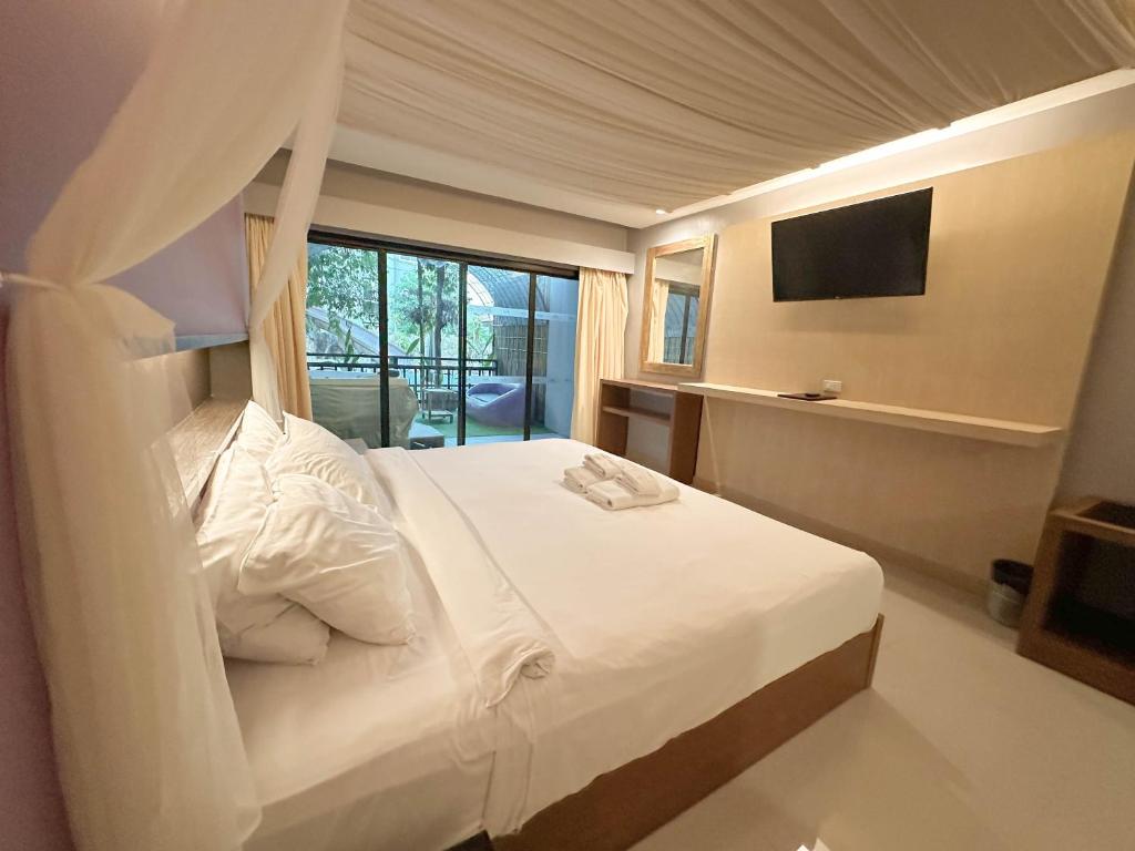 Postel nebo postele na pokoji v ubytování Phuvaree Resort