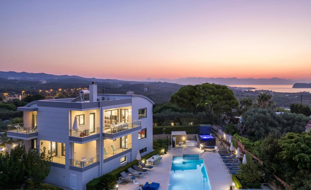 an aerial view of a house with a swimming pool at Elysium Seaview Oasis in Kato Galatas