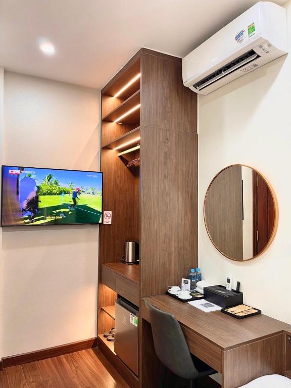 TV a/nebo společenská místnost v ubytování The Cosy Inn Hanoi
