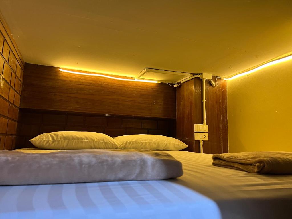 Cama o camas de una habitación en LONGDOO Hostel