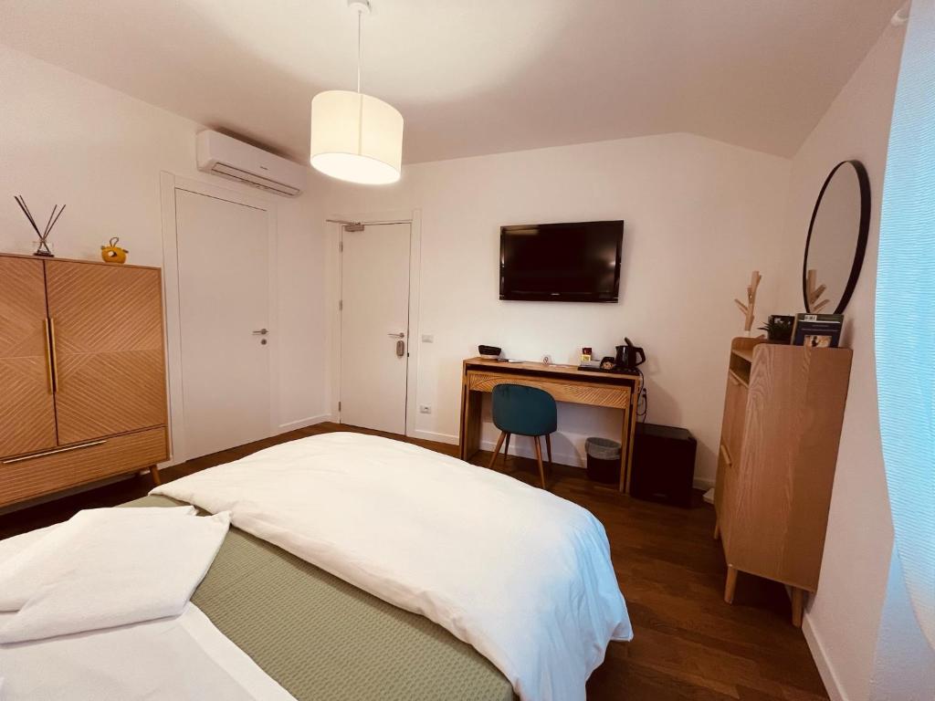 Postel nebo postele na pokoji v ubytování CIVICO 27 rooms