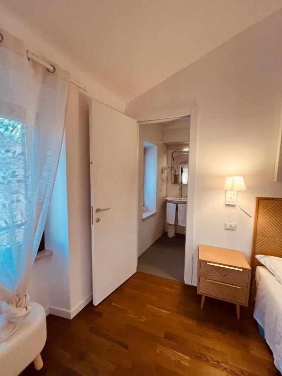 Postel nebo postele na pokoji v ubytování CIVICO 27 rooms