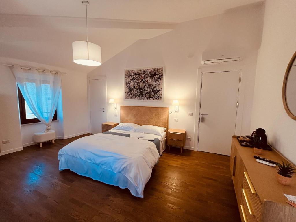 Postel nebo postele na pokoji v ubytování CIVICO 27 rooms