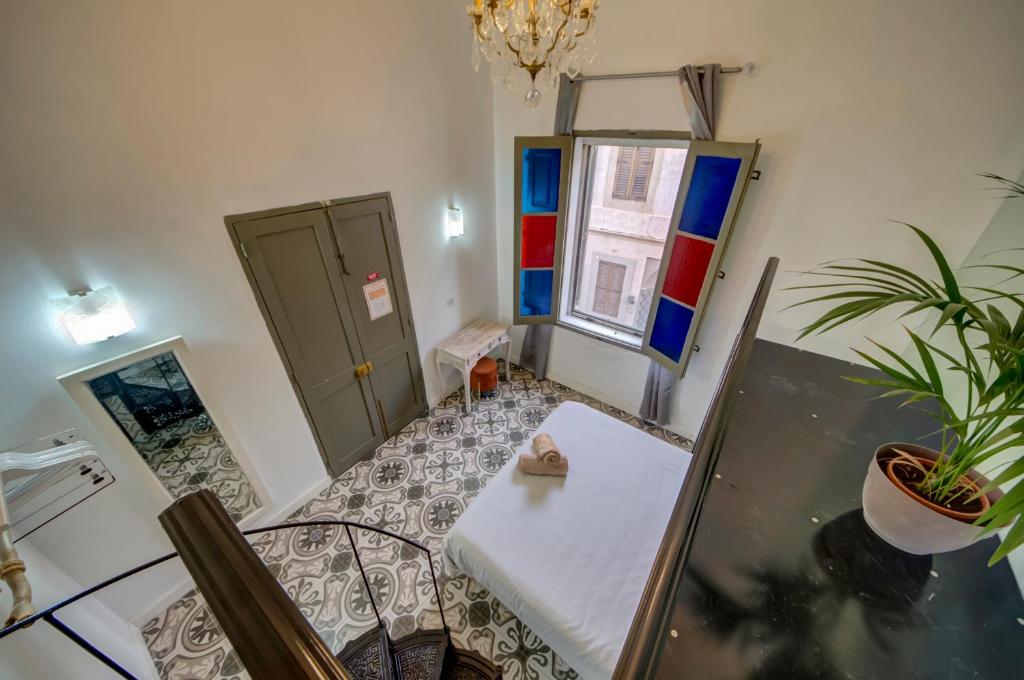 Postel nebo postele na pokoji v ubytování Boho Rooms Sliema