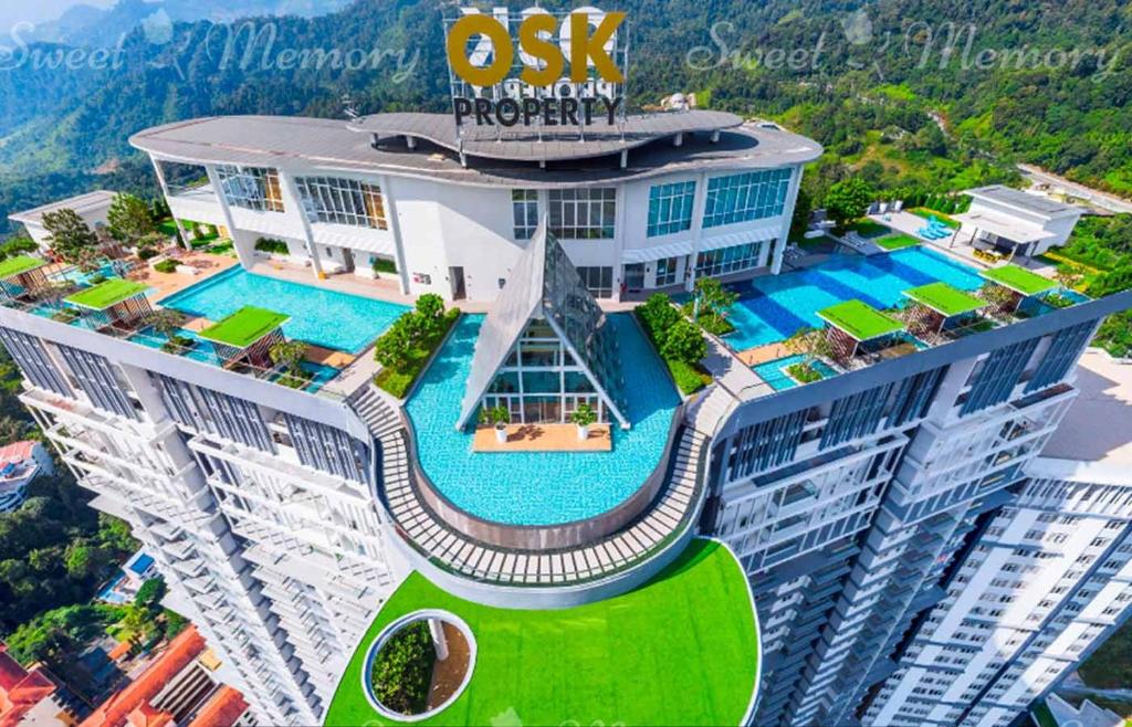 an aerial view of a building with a swimming pool at Windmill Upon Hills Genting Highland by Sweet Memory in Genting Highlands