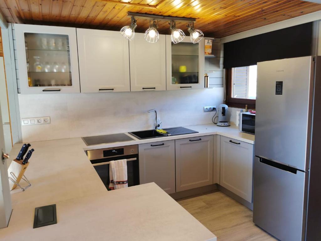 Kuchyň nebo kuchyňský kout v ubytování Chalet HEUREux