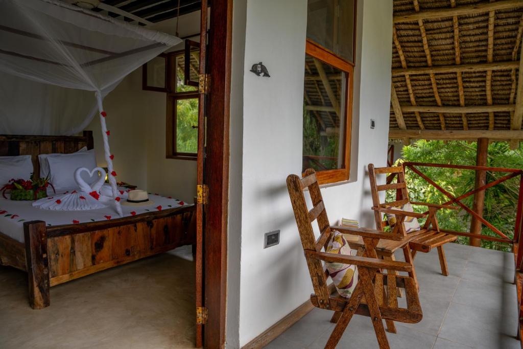 Ein Bett oder Betten in einem Zimmer der Unterkunft Maisha Nungwi - Boutique Hotel