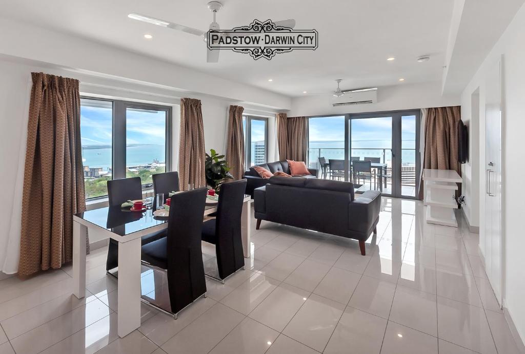 a living room with a couch and a table at "PADSTOW" Top Location & Views at PenthousePads in Darwin