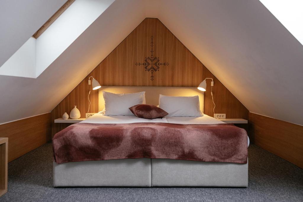 Postel nebo postele na pokoji v ubytování Hotel Majerca