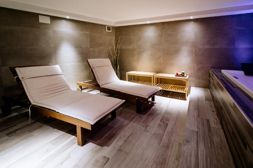 a room with two chairs and a pool table at Villetta Ginori - Private Spa in Grosseto