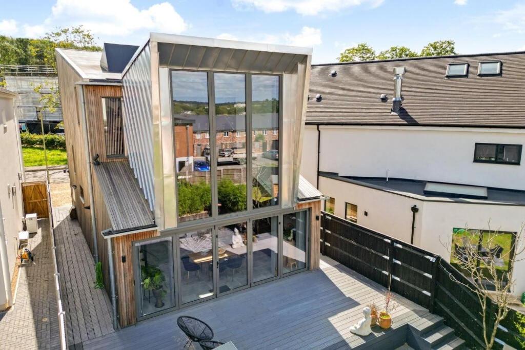 a view of a house from the balcony of a building at 3BR Gem, 8 Min Drive to Bicester Village in Bicester