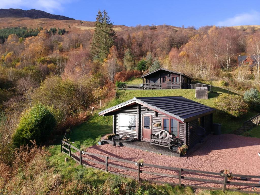a small cabin in the middle of a field at Chalet Highand Lodges-1 by Interhome in Spean Bridge