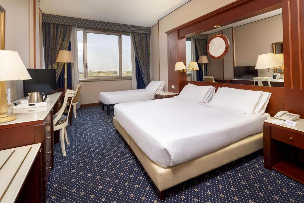Łóżko lub łóżka w pokoju w obiekcie Best Western CTC Hotel Verona