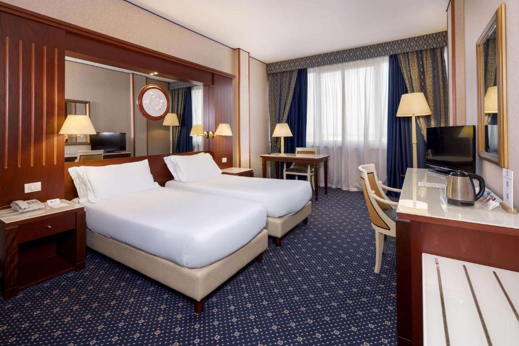 Łóżko lub łóżka w pokoju w obiekcie Best Western CTC Hotel Verona