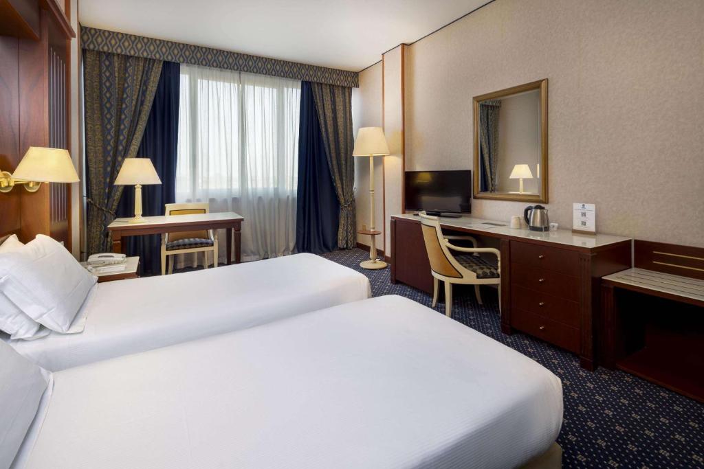 Łóżko lub łóżka w pokoju w obiekcie Best Western CTC Hotel Verona