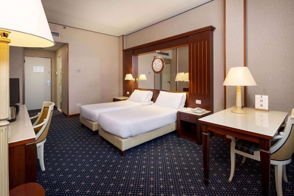 Łóżko lub łóżka w pokoju w obiekcie Best Western CTC Hotel Verona