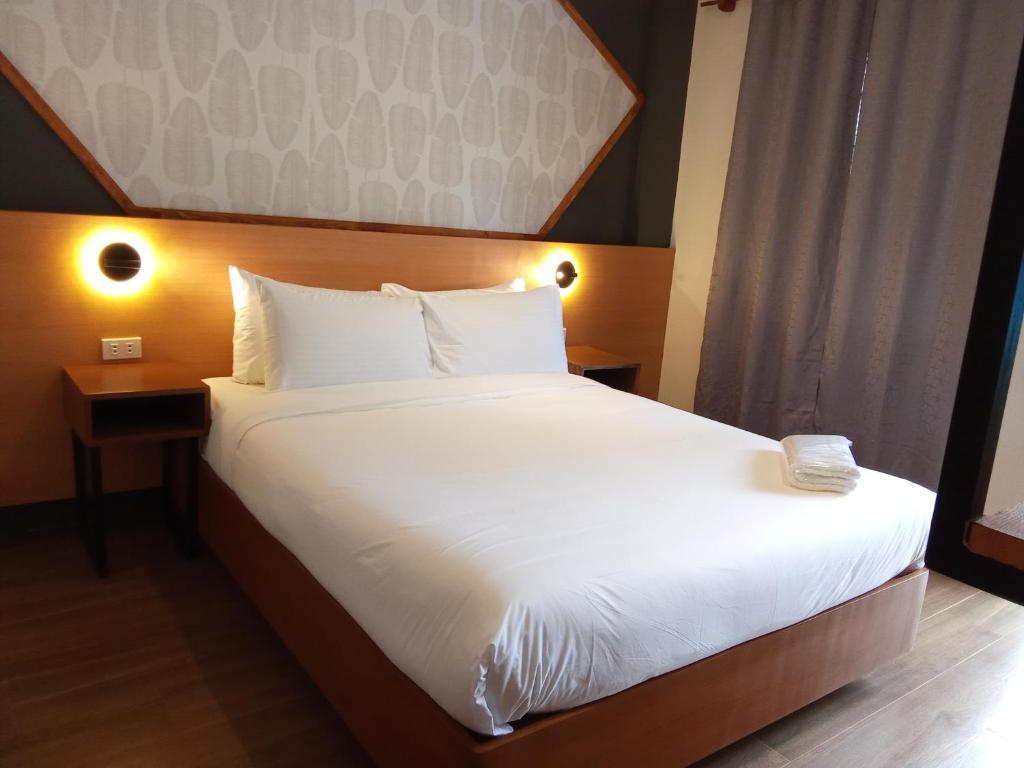 Postel nebo postele na pokoji v ubytování Jovinaj Travellers Inn