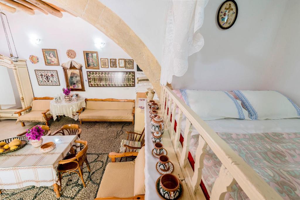 A bed or beds in a room at Kamariko Traditional House