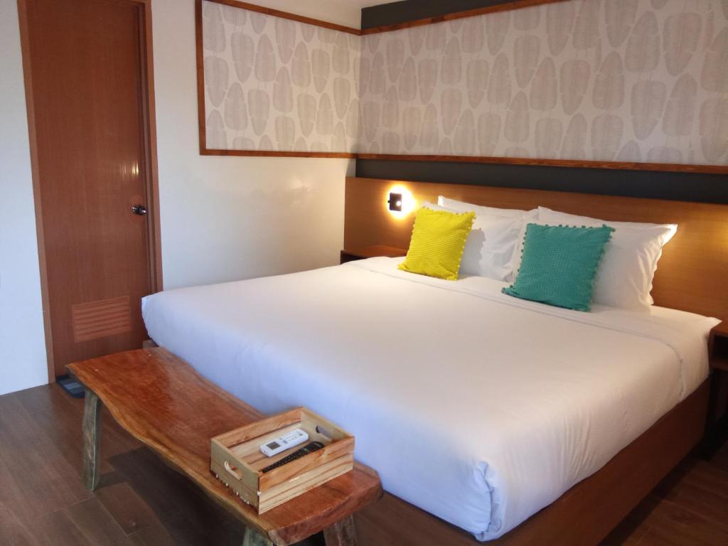 Postel nebo postele na pokoji v ubytování Jovinaj Travellers Inn