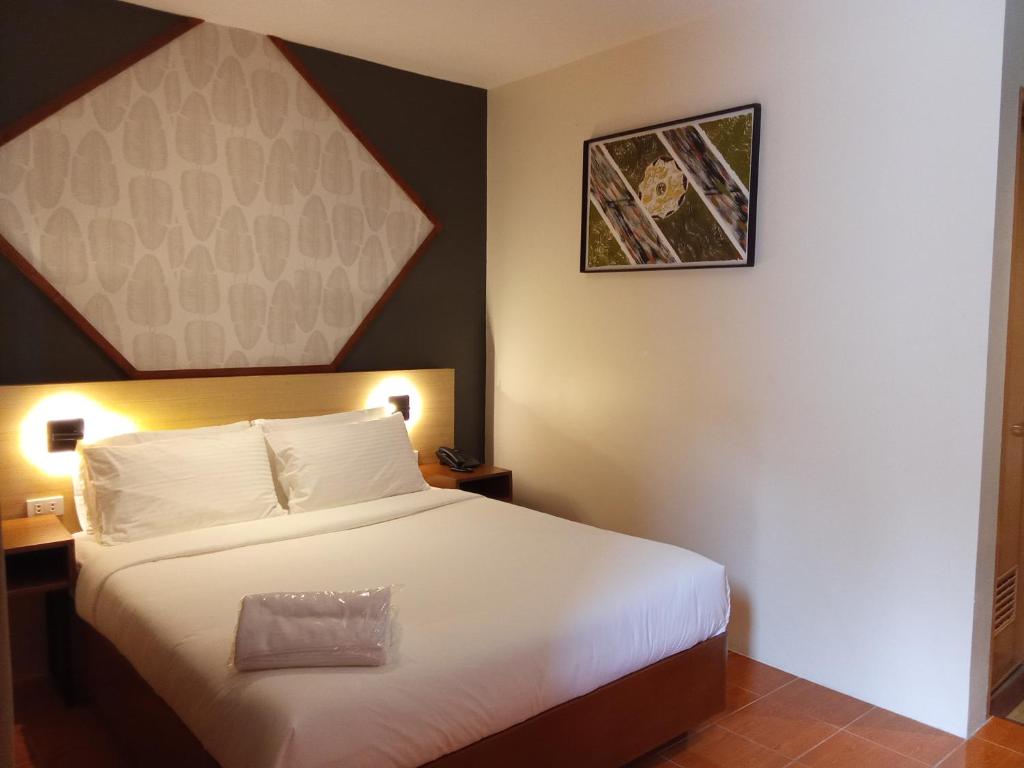 Postel nebo postele na pokoji v ubytování Jovinaj Travellers Inn