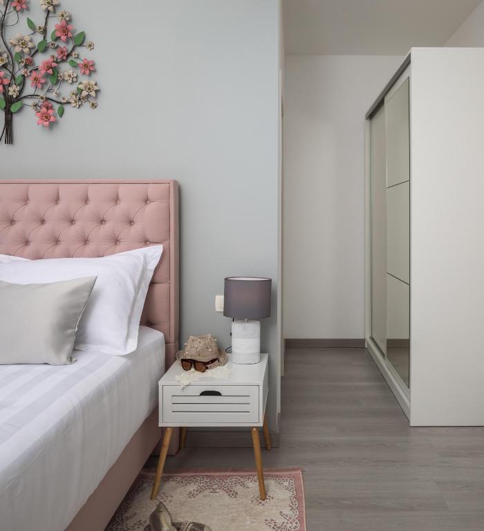Postel nebo postele na pokoji v ubytování Villa Harmony