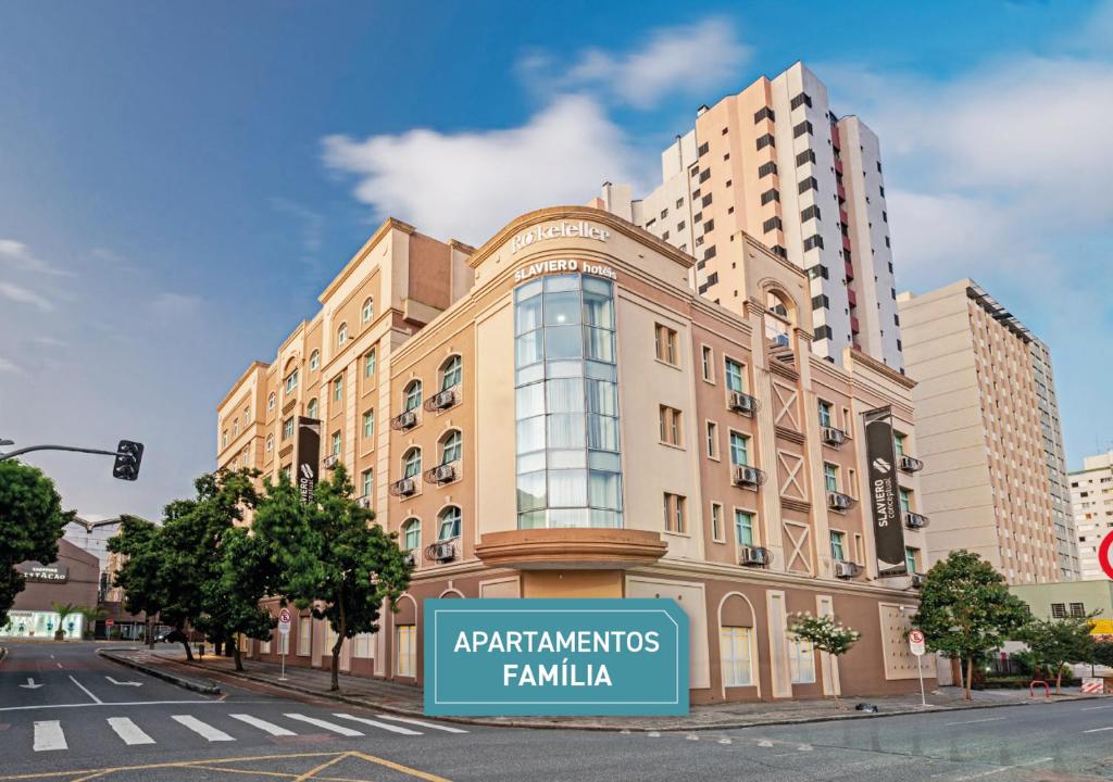 a large building with a sign in front of it at ROCKEFELLER by Slaviero Hotéis in Curitiba