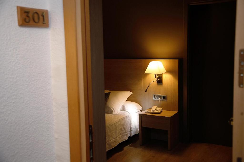 Postel nebo postele na pokoji v ubytování Balneari Termes Victòria