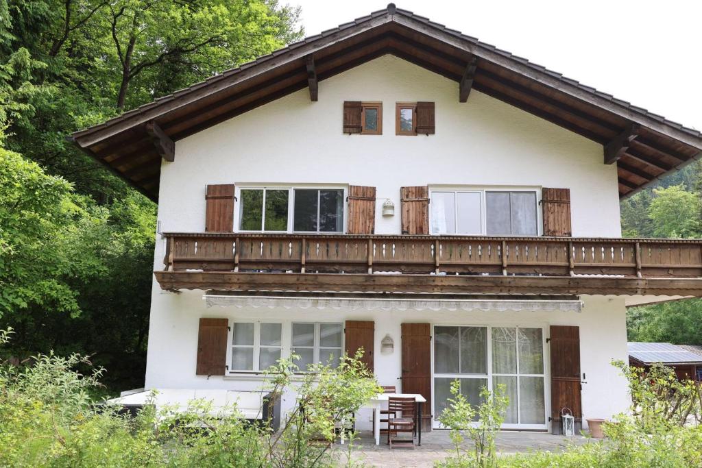 a house with a balcony on top of it at Ferienhaus 4 Peaks in Bayerisch Gmain