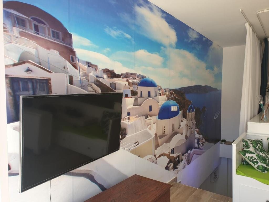 Telewizja i/lub zestaw kina domowego w obiekcie CALTERR - Loft con Terraza privada, Wifi, Recién reformado