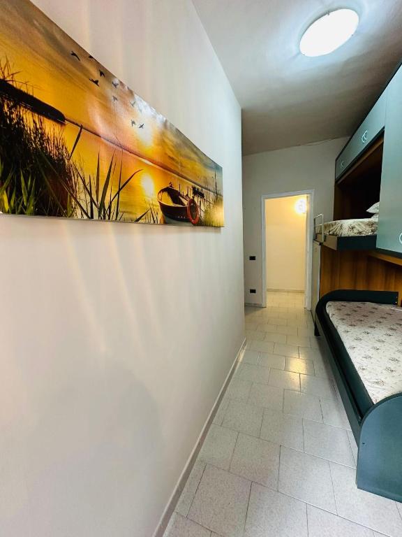 a room with a painting hanging on the wall at Ferdirisa Vesuvio Home&Garden in San Giorgio a Cremano
