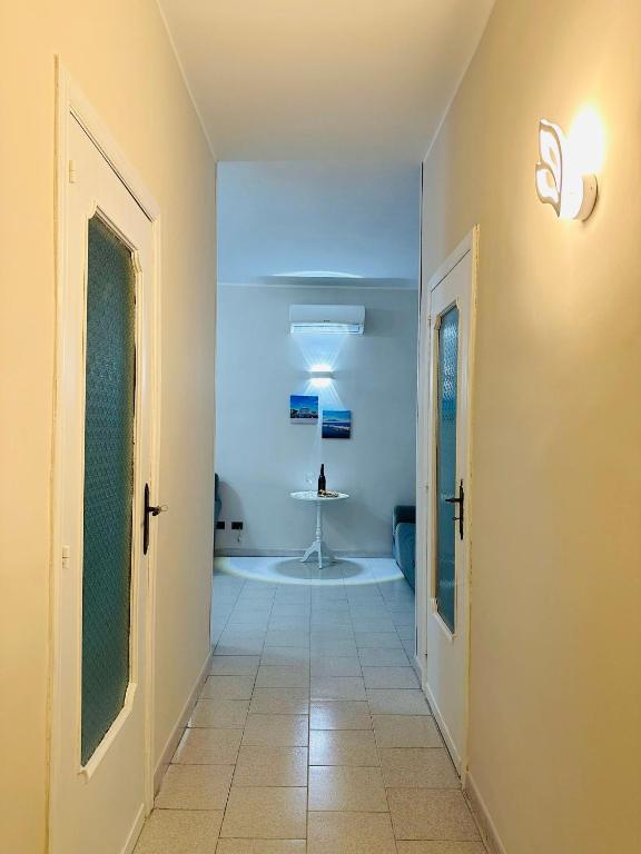 a hallway with a room with a table in it at Ferdirisa Vesuvio Home&Garden in San Giorgio a Cremano
