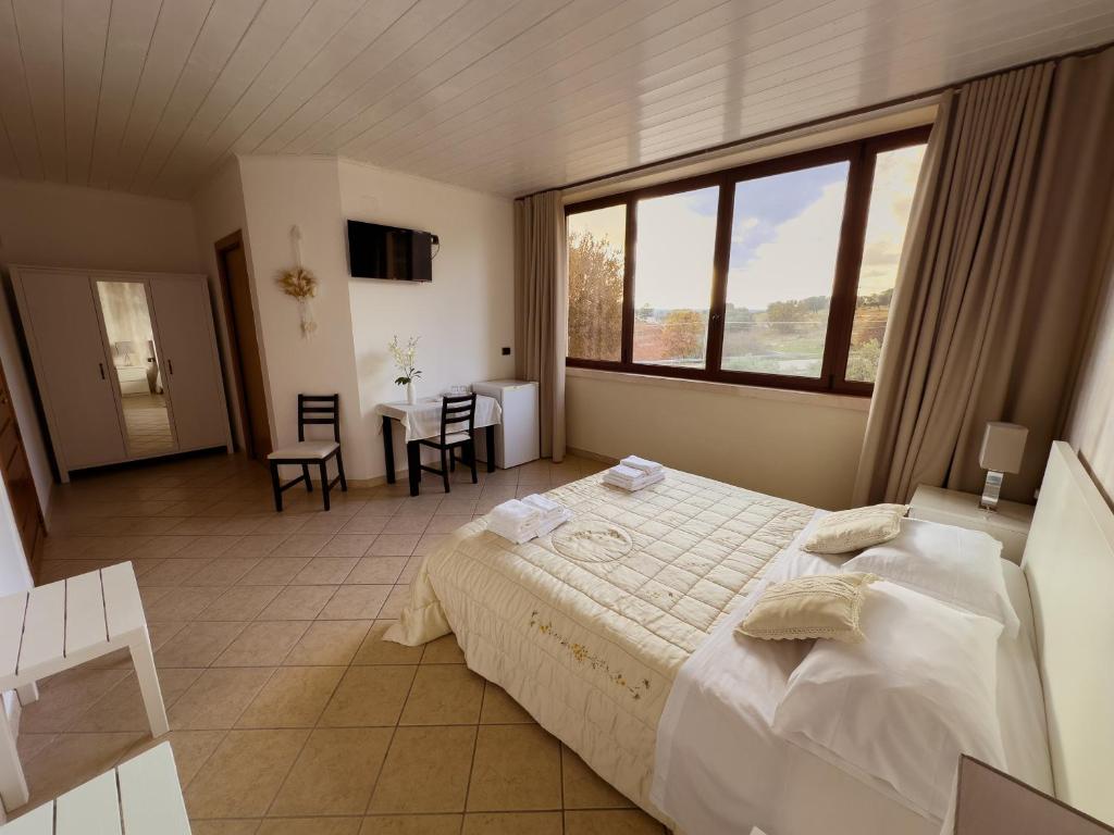 Letto o letti in una camera di B&B Il Leccio