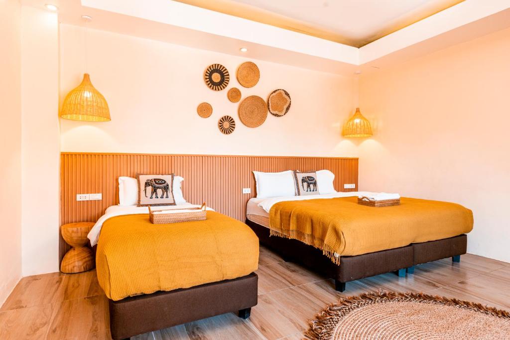 Postel nebo postele na pokoji v ubytování Molly Resorts
